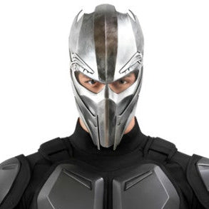 A man wearing a black and gray futuristic ninja-style costume with a silver metal mask, shown against a plain white background.