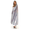 Woman wearing a silver holographic raincoat on a white background