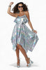 Woman wearing a checkered dress with a white background