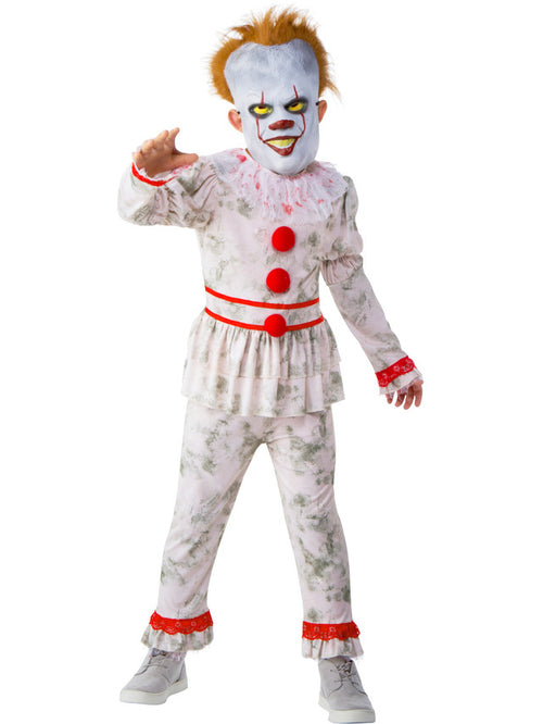Child wearing a clown costume with white face, red buttons, and red accents on a white background