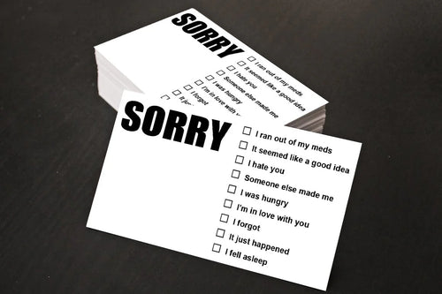 Two 'Sorry' cards with checkboxes on a dark surface