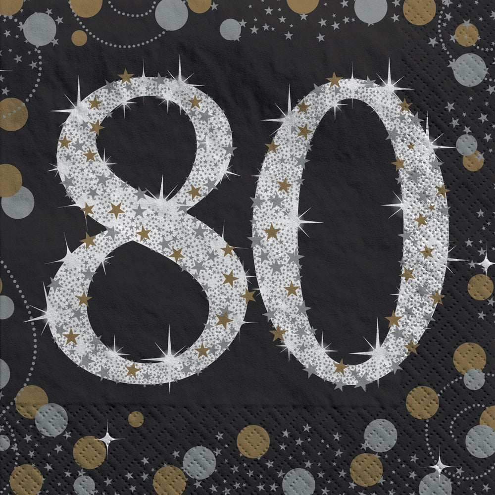 Black paper napkin with silver '80' design and starburst patterns on a black background
