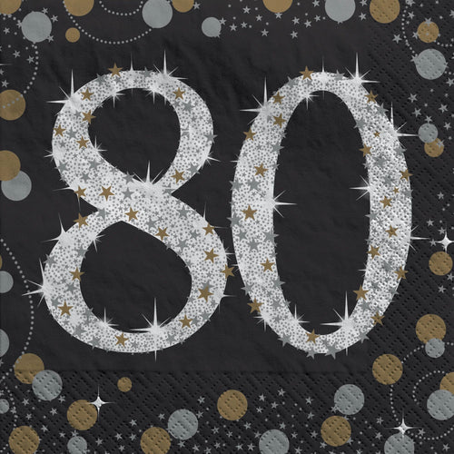 Black paper napkin with silver '80' design and starburst patterns on a black background