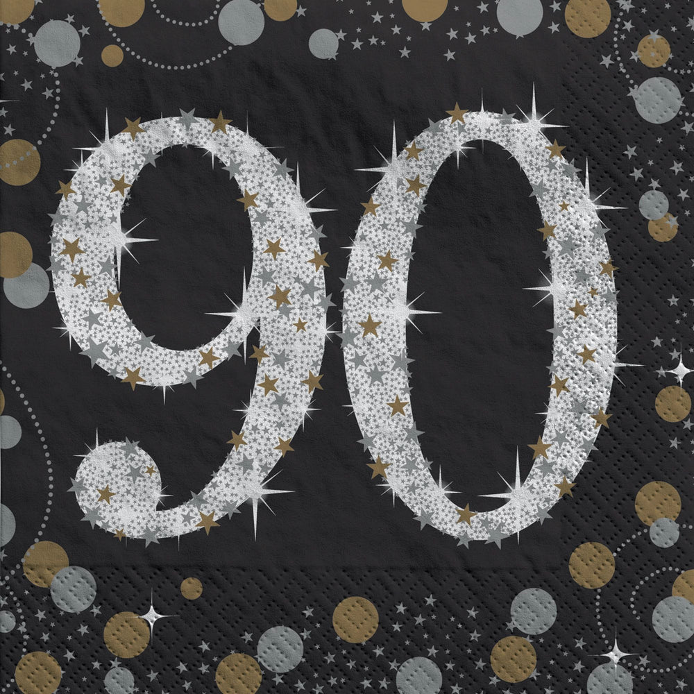 Napkin with '90' in silver glitter on a black background with gold and silver confetti