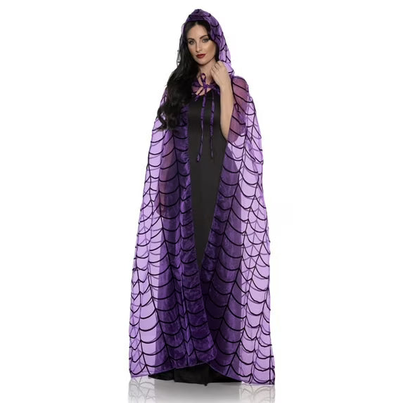 Woman wearing a purple spider web cape on a white background