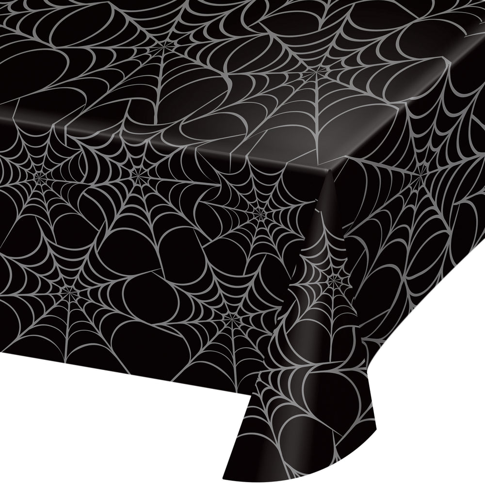 Black tablecloth with spider web pattern on a white background