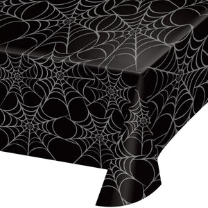 Black tablecloth with spider web pattern on a white background
