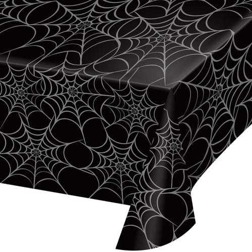 Black tablecloth with spider web pattern on a white background