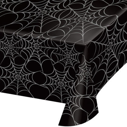 Black tablecloth with spider web pattern on a white background