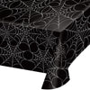 Black tablecloth with spider web pattern on a white background