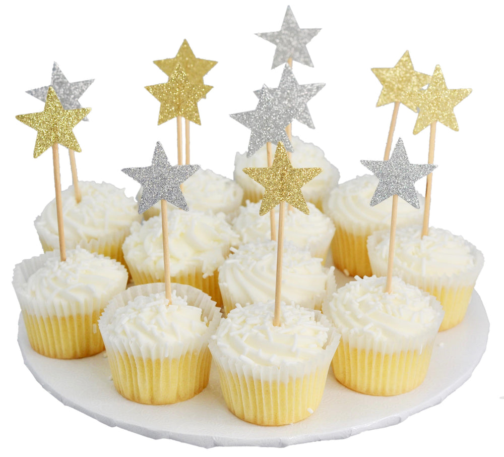 Cupcakes with star-shaped toppers on a white plate
