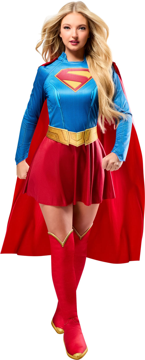 Person wearing a Supergirl costume with a red cape and blue bodice.