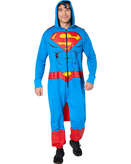 Person wearing a Superman onesie on a white background