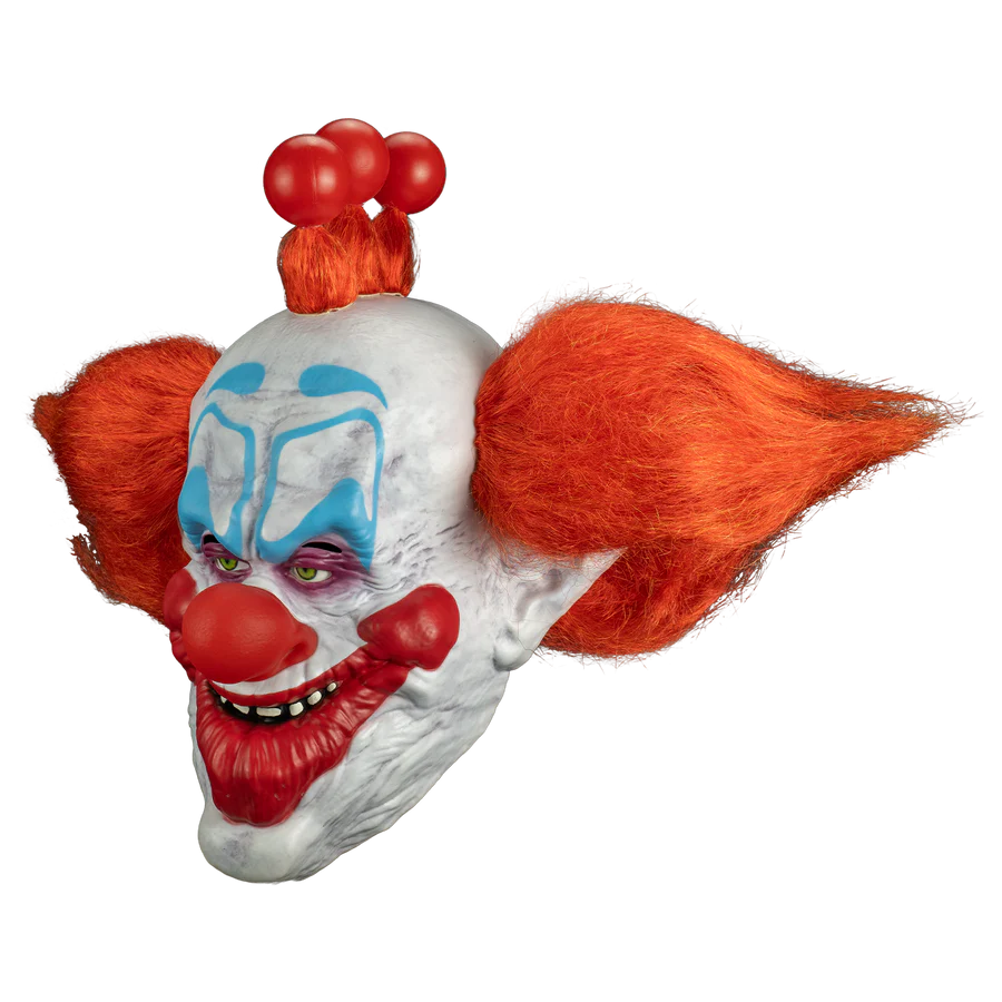 Clown mask with red hair and makeup on a white background