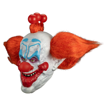 Clown mask with red hair and makeup on a white background