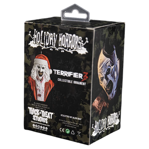 Terrifier 3 Holiday Horrors collectible ornament packaging box by Trick or Treat Studios, featuring a black camouflage design with Santa and a mask illustration.
