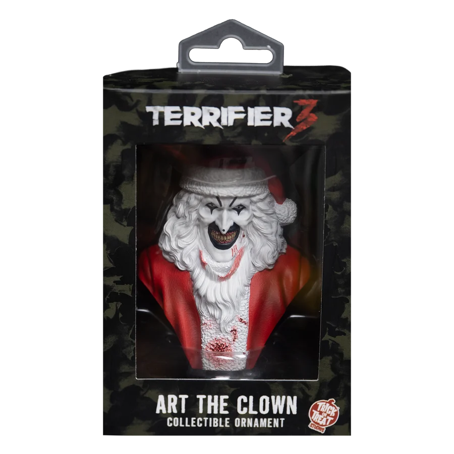 Terrifier 3 Art the Clown collectible ornament in its original window box packaging, featuring a creepy clown Santa Claus figure with white hair, red jacket, and blood splatters.