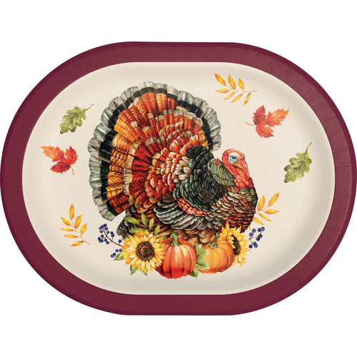 An oval Thanksgiving serving platter with a deep burgundy rim, featuring a detailed illustration of a turkey surrounded by autumn leaves, sunflowers, and pumpkins on a cream background.