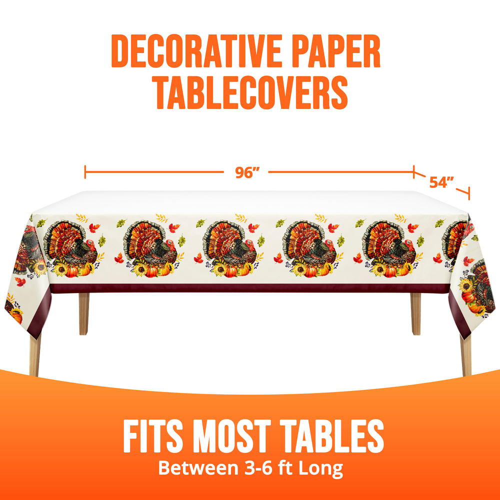 A decorative paper tablecover with a Thanksgiving turkey print shown draped over a table, with orange text reading 'DECORATIVE PAPER TABLECOVERS' and size lines indicating 96 inches by 54 inches. The bottom text says 'FITS MOST TABLES Between 3-6 ft Long'.