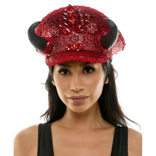 Woman wearing a red sequined hat with black accents on a white background