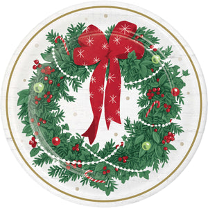 Decorative plate with a Christmas wreath and red bow design on a white background