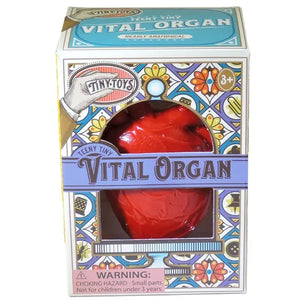 Red toy heart in a decorative box with 'Tiny Toys' branding