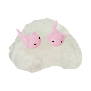 Two small pink axolotl figurines with black eyes resting on a white, cloud-like textured base against a plain white background.