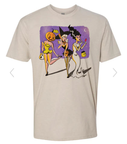 Beige t-shirt with Halloween-themed graphic of three women and pumpkins on a white background