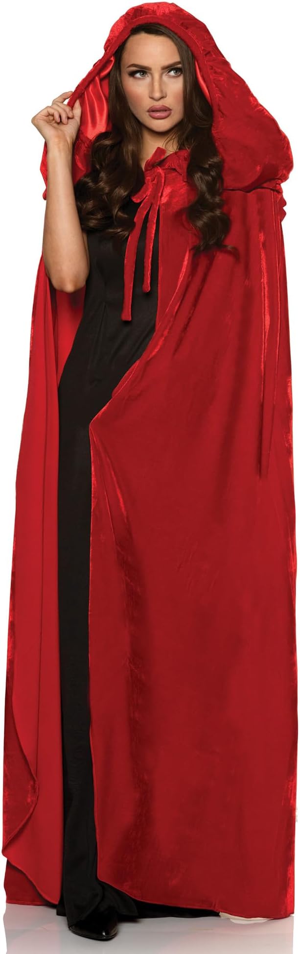 Woman wearing a red hooded cloak over a black dress