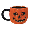 Pumpkin-shaped mug with a jack-o'-lantern face on a white background