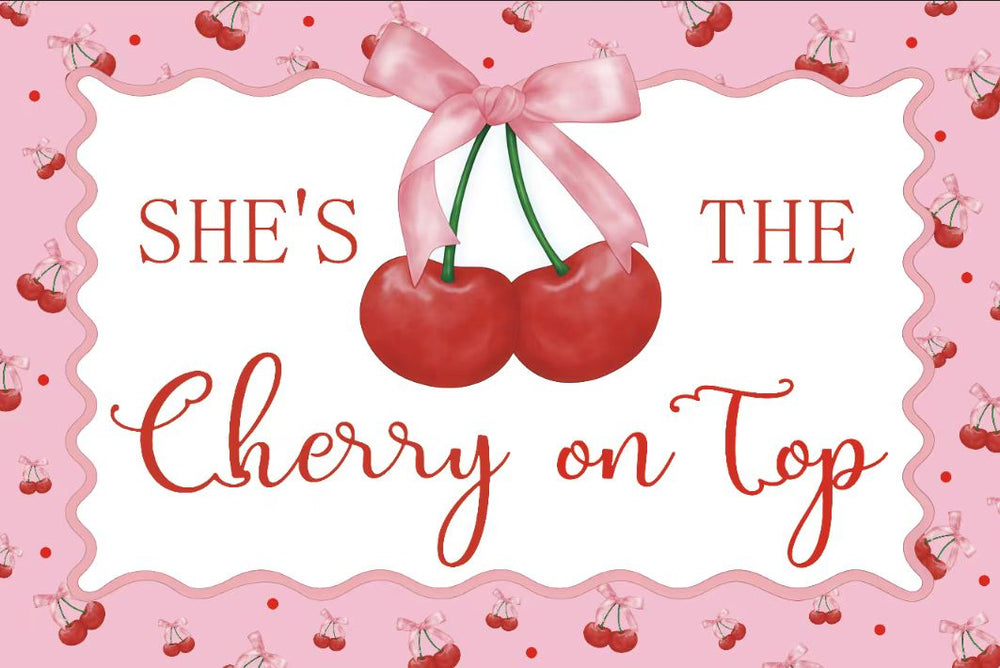 Decorative card with cherries and text 'She's the cherry on top' on a pink background.
