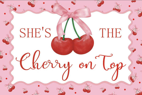 Decorative card with cherries and text 'She's the cherry on top' on a pink background.