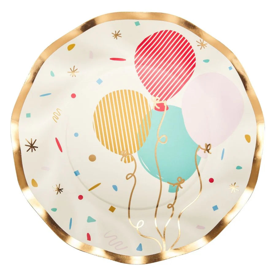 Decorative plate with colorful balloons and a gold rim on a white background