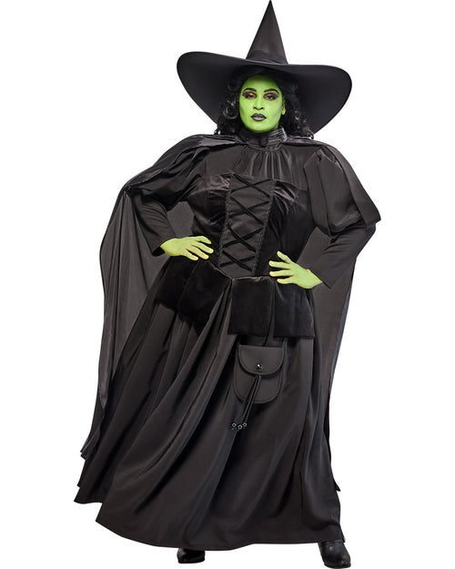 Witch costume with black hat, cloak, and green face on a white background