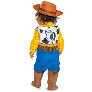 Child wearing a Woody costume from Toy Story on a white background