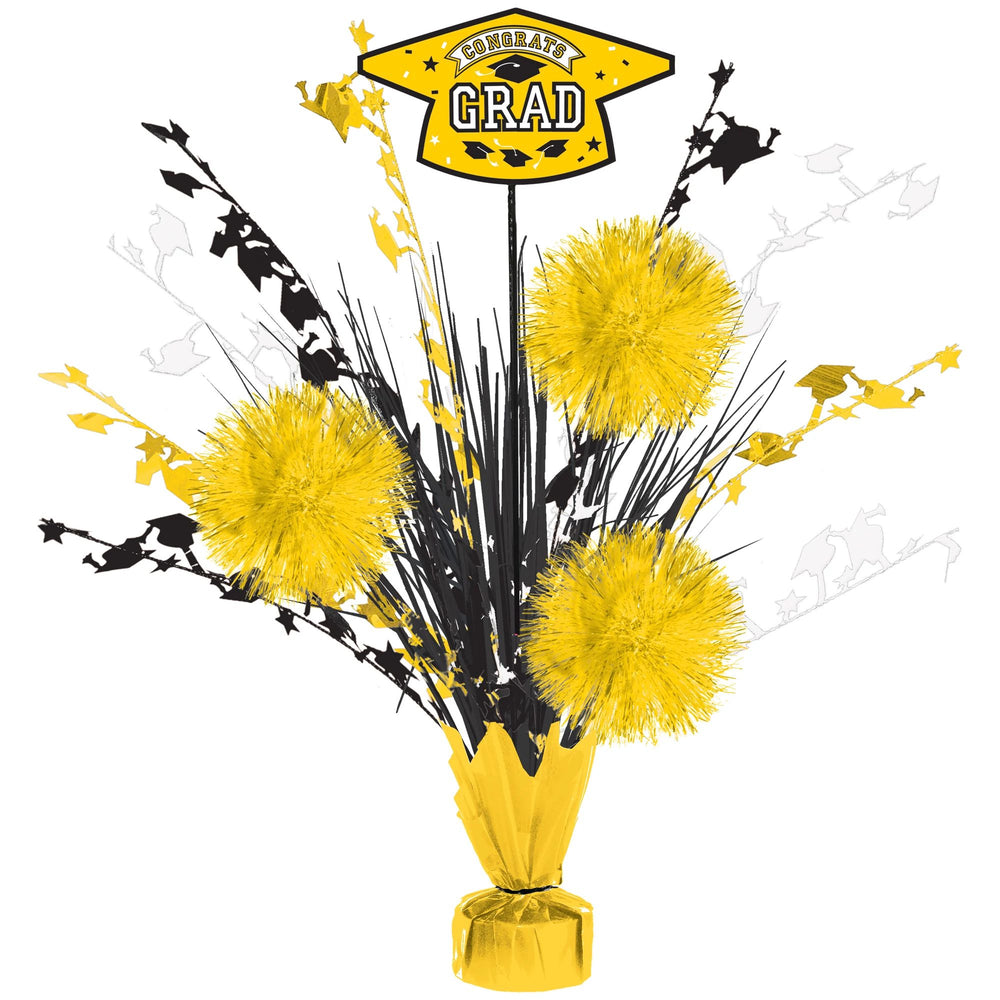 Graduation-themed centerpiece with yellow and black decorations on a white background
