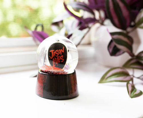 THANK GOODNESS IT'S FRIDAY  There is no place to hide when Jason Voorhees is on your trail. Now the masked slasher with an affinity for machetes can always keep a close eye on you. Evil rises again with this collectible mini snow globe that recalls the disturbing events that happen on Friday the 13th. The miniature hockey mask that sits inside the globe is painted with hardened wear and tear.  YOU'RE NOT EVEN SAFE IN SPACE