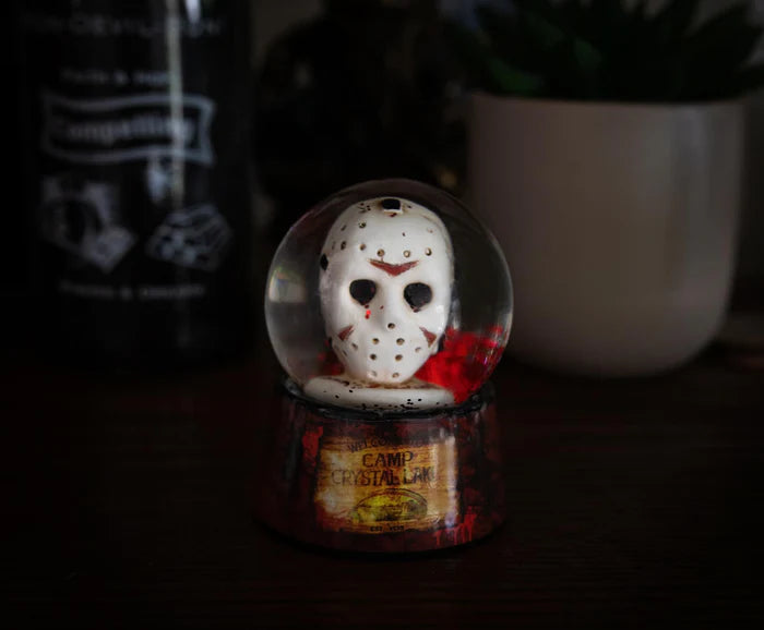 THANK GOODNESS IT'S FRIDAY  There is no place to hide when Jason Voorhees is on your trail. Now the masked slasher with an affinity for machetes can always keep a close eye on you. Evil rises again with this collectible mini snow globe that recalls the disturbing events that happen on Friday the 13th. The miniature hockey mask that sits inside the globe is painted with hardened wear and tear.  YOU'RE NOT EVEN SAFE IN SPACE