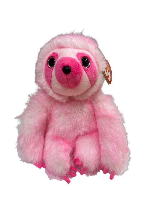 A pink sloth plush toy with a fuzzy texture, large black eyes, and a hangtag, sitting on a white sheet of paper on a desk.