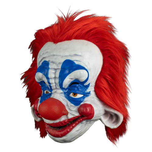 Clown mask with red hair, white face, and blue face paint on a white background