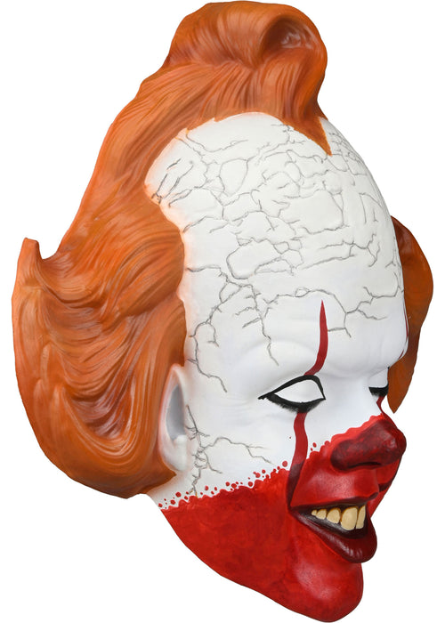 Clown mask with red hair, white face, and red accents on a white background