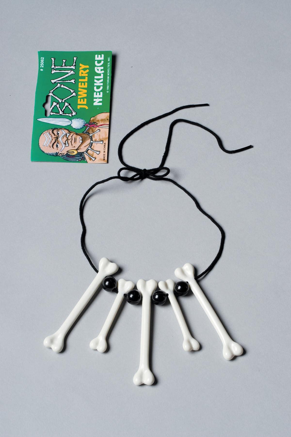 Black beads, white bones tie necklace