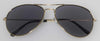 Gold rimmed glasses with tinted lenses